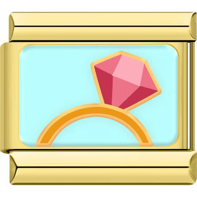Gold Italian charm with a gold band and a large pink gemstone on a blue background.