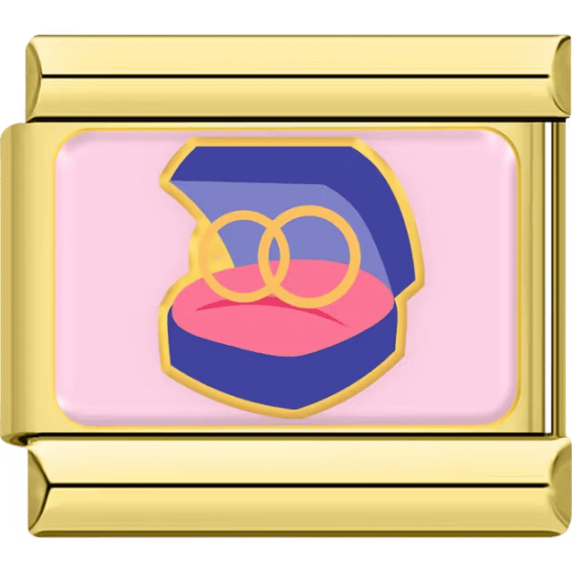 Engagement ring box with two gold rings on a gold Italian charm