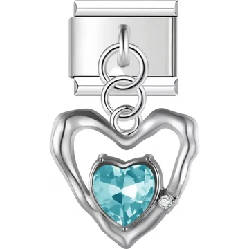 Open heart frame with blue faceted crystal centerpiece and small clear stone accent Italian charm bracelet link