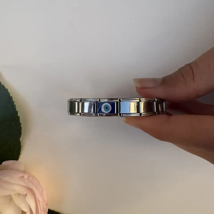 Blue evil eye on a silver and blue rectangular Italian charm bracelet link