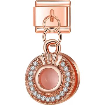 Dangling circular design featuring a central pink stone surrounded by clear stones in a rose gold finish Italian charm bracelet link