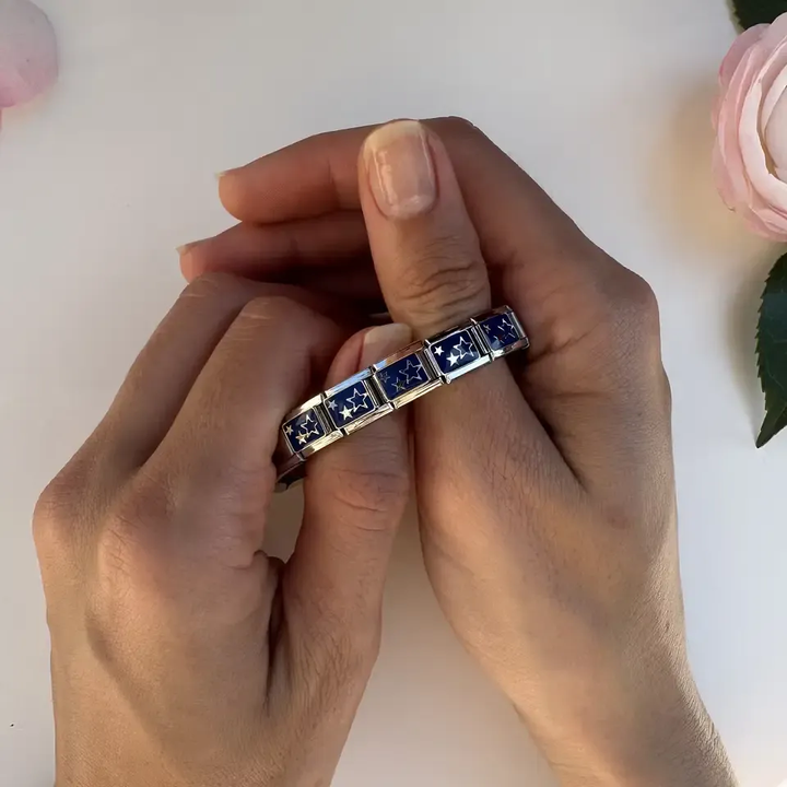 Gold stars in solid and outline designs on a blue background Italian charm bracelet link