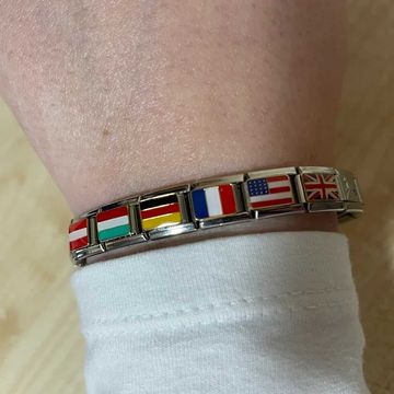 Silver Italian charm bracelet featuring multiple flag charms including Austria, Hungary, Germany, France, United States, and United Kingdom