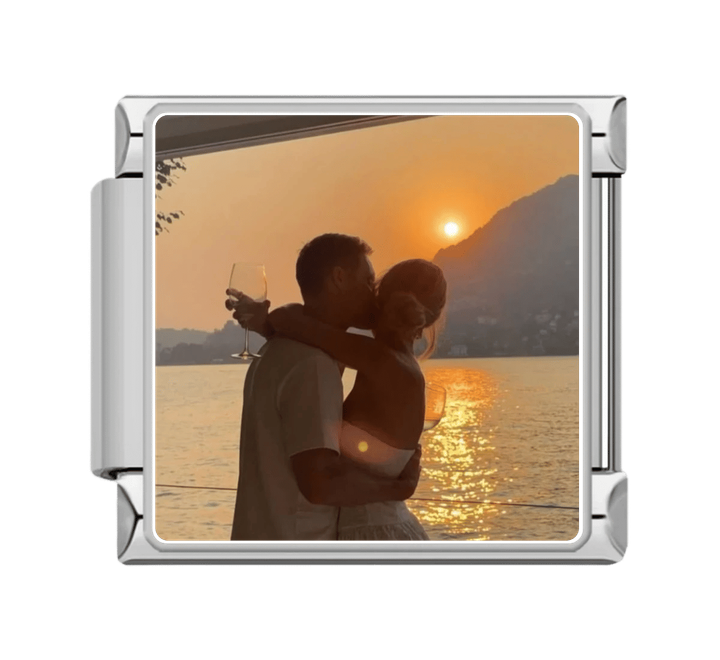 Silver charm with custom photo of couple embracing at sunset