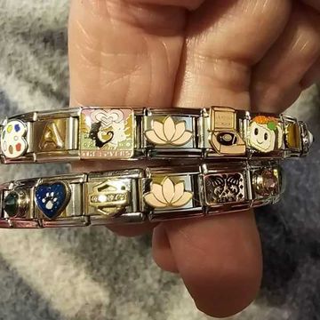 Two Italian charm bracelets with gold and silver charms